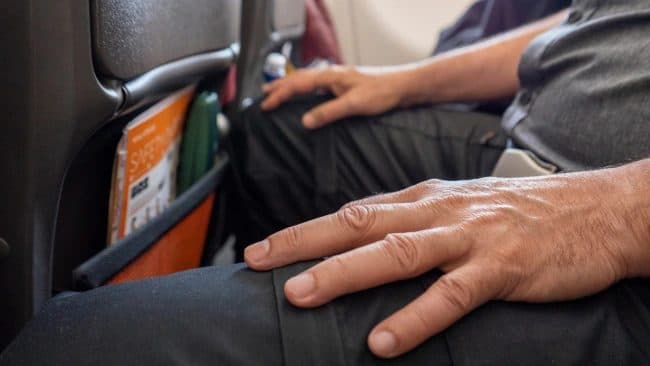 Man Lies to Flight Attendant That He Has No Trash When In Fact He Has Trash.
